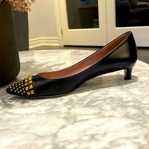 A sleek pair of Gucci, black, 1 inch heels. Size 37 / 7